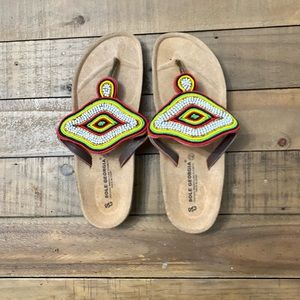 Never worn sandals. Beaded. Maid in Spain